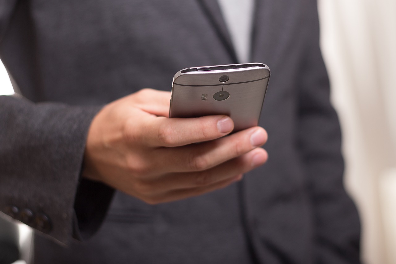 Person testing smartphone camera features