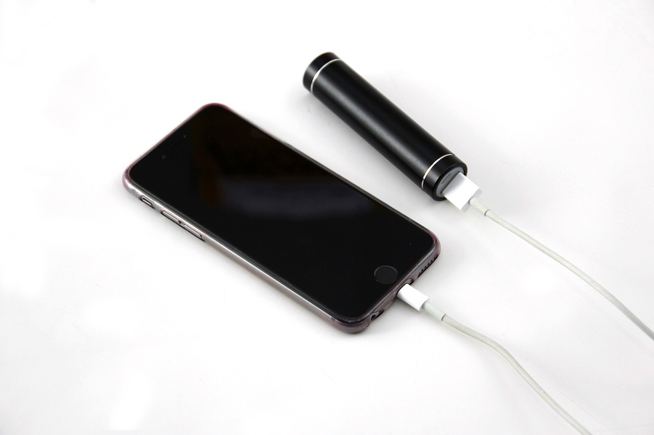 Slim smartphone next to a battery icon